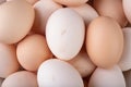 Fresh chicken eggs stacked on top of each other. A pile of eggs on the kitchen table Royalty Free Stock Photo