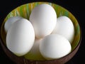 Fresh chicken eggs in a vietnamese coconut bowl