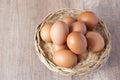 fresh chicken eggs in a wicker basket Royalty Free Stock Photo
