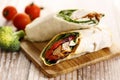 Fresh chicken fajita wrap sandwiches on wooden plank Royalty Free Stock Photo