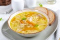 Fresh chicken soup with vegetables and stelline pasta in a bowl