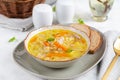 Fresh chicken soup with vegetables and stelline pasta in a bowl