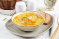 Fresh chicken soup with vegetables and stelline pasta in a bowl