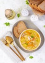 Fresh chicken soup with vegetables and stelline pasta in a bowl with carrot and parsley. Royalty Free Stock Photo