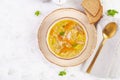 Fresh chicken soup with vegetables and stelline pasta in a bowl with carrot and parsley. Royalty Free Stock Photo