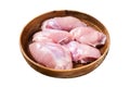 Fresh Chicken thigh meat, Raw Boneless and skinless fillet in a wooden plate. Isolated on white background. Top view. Royalty Free Stock Photo