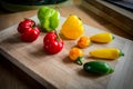 Fresh chilies on wood chopping board #1