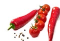 Chilli, black pepper and fresh cherry tomatoes on a white background