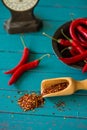 Fresh chilli and seeds on table with vintage scale Royalty Free Stock Photo