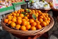 Fresh chinese oranges in wooden basket