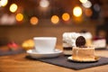 Fresh chocholate cake with sweet biscuit on top in a coffee shop