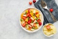 Fresh chopped fruit salad in a bowl.