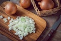 Fresh chopped onions on wooden cutting board Royalty Free Stock Photo