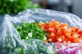 Fresh chopped salad vegetable in plastic food bag