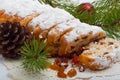 Fresh Christmas Stolle Dresden with raisins closeup with pine br