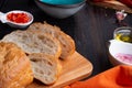 Fresh ciabatta bread with blue bowl and ingredients served at dark wooden table. meditarranean cuisine. close up