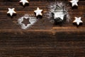 Fresh cinnamon star shaped cookies with frosting on wooden table