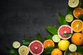 Fresh citrus fruit assortment on black. Royalty Free Stock Photo