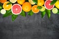 Fresh citrus fruit assortment on black. Royalty Free Stock Photo