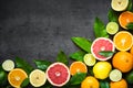 Fresh citrus fruit assortment on black. Royalty Free Stock Photo