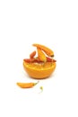 Slice of fresh citrus fruit and vegetable chili on it on a plain white background