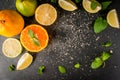Fresh citrus fruits on a black slate table Royalty Free Stock Photo