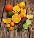 Fresh citrus fruits and old juicer Royalty Free Stock Photo