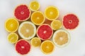 Fresh citrus fruits orange, lemon, grapefruit, pomelo half-sliced from above, pattern for layout. concept of healthy eat food Royalty Free Stock Photo