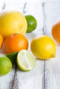 Fresh citrus fruits on white rustic wooden background Royalty Free Stock Photo