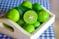 Fresh Citrus lime fruit in wooden box Royalty Free Stock Photo