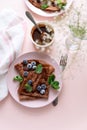 Homemade chocolate crepes served with blueberries, sauce and mint leaves on pink background. Selective focus. Top view. Copy space Royalty Free Stock Photo