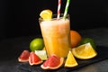 Fresh citrus smoothie juice at dark background. Royalty Free Stock Photo