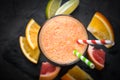 Fresh citrus smoothie juice at dark background. Royalty Free Stock Photo