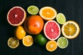 Fresh citrus stihli. Lemons, limes, grapefruit and orange on a black background Royalty Free Stock Photo