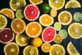 Fresh citrus stihli. Lemons, limes, grapefruit and orange on a black background Royalty Free Stock Photo