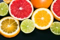 Fresh citrus stihli. Lemons, limes, grapefruit and orange on a black background Royalty Free Stock Photo