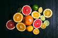 Fresh citrus stihli. Lemons, limes, grapefruit and orange on a black background Royalty Free Stock Photo