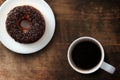 Fresh classic donuts with hot black coffee Royalty Free Stock Photo