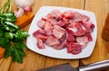 Raw chicken gizzards with seasonings Royalty Free Stock Photo