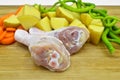 Fresh clean raw chicken legs. Drumsticks and healthy vegetables. Royalty Free Stock Photo