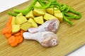 Fresh clean raw chicken legs. Drumsticks and healthy vegetables. Royalty Free Stock Photo