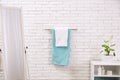 Fresh towels on hanger in bathroom Royalty Free Stock Photo