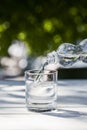 Clean water pouring from bottle in Royalty Free Stock Photo