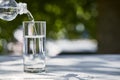 Clean water pouring from bottle in Royalty Free Stock Photo