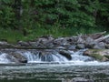 Fresh clean water running over rocks creating small waterfalls Royalty Free Stock Photo