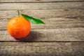 Fresh Clementine or Mandarin orange with leaves on wooden background Royalty Free Stock Photo