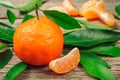 Fresh Clementine or Mandarin orange with leaves on wooden background Royalty Free Stock Photo