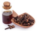 Fresh clove with oil in a jar Royalty Free Stock Photo