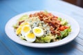 fresh cobb salad on white plate, blue cheese crumbs on top Royalty Free Stock Photo