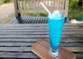 Fresh cocktail with blue placed on a wooden table Royalty Free Stock Photo